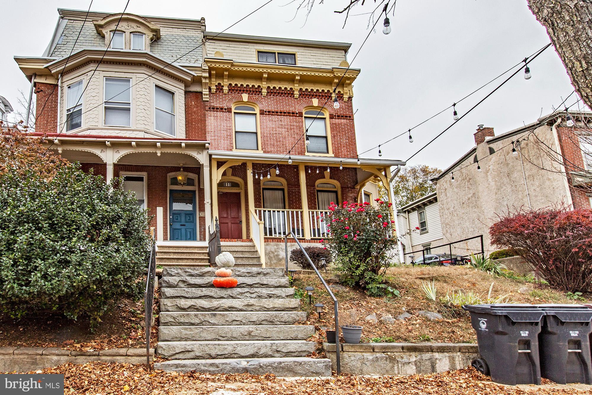 a front view of a residential apartment building with a yard