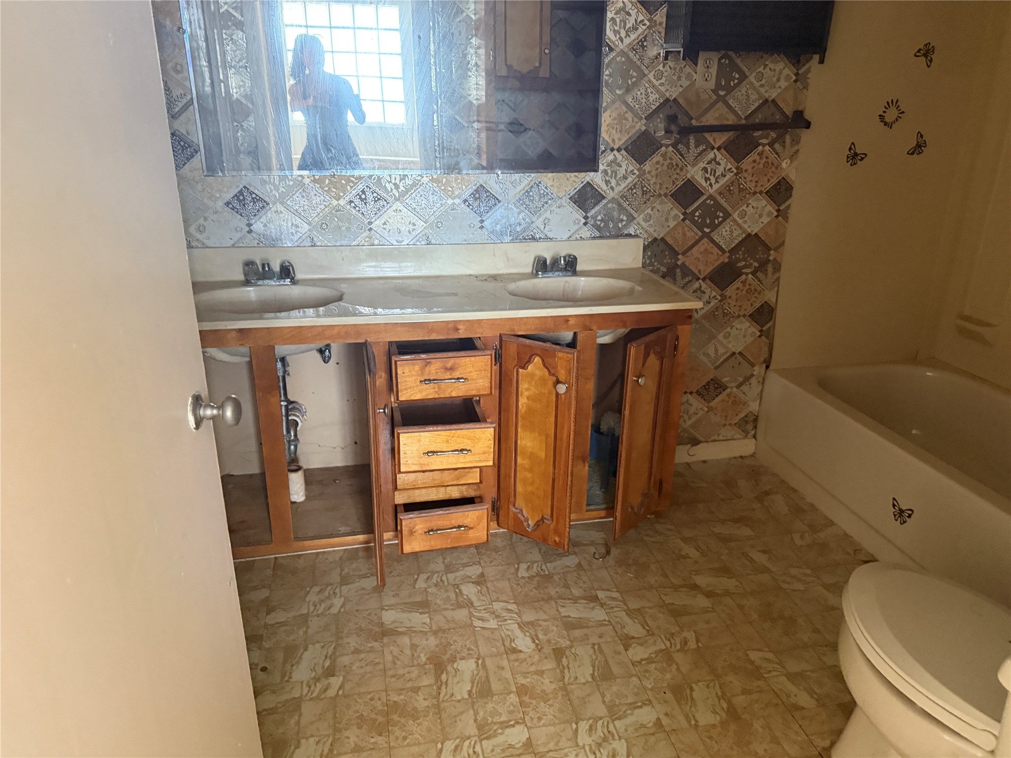 4302 Fernwood Drive Houston, TX 77021 - Photo 9 of 15 a bathroom with a granite countertop sink toilet and shower