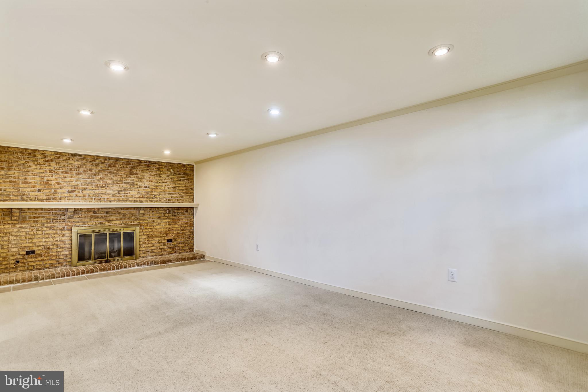 9525 Burning Branch Road Burke, VA 22015 - Photo 8 of 55 Wood burning fireplace in entry level living room