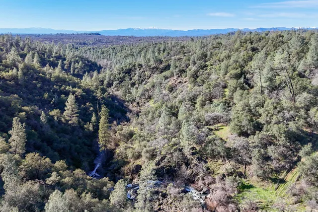 a view of a city with mountains in the background