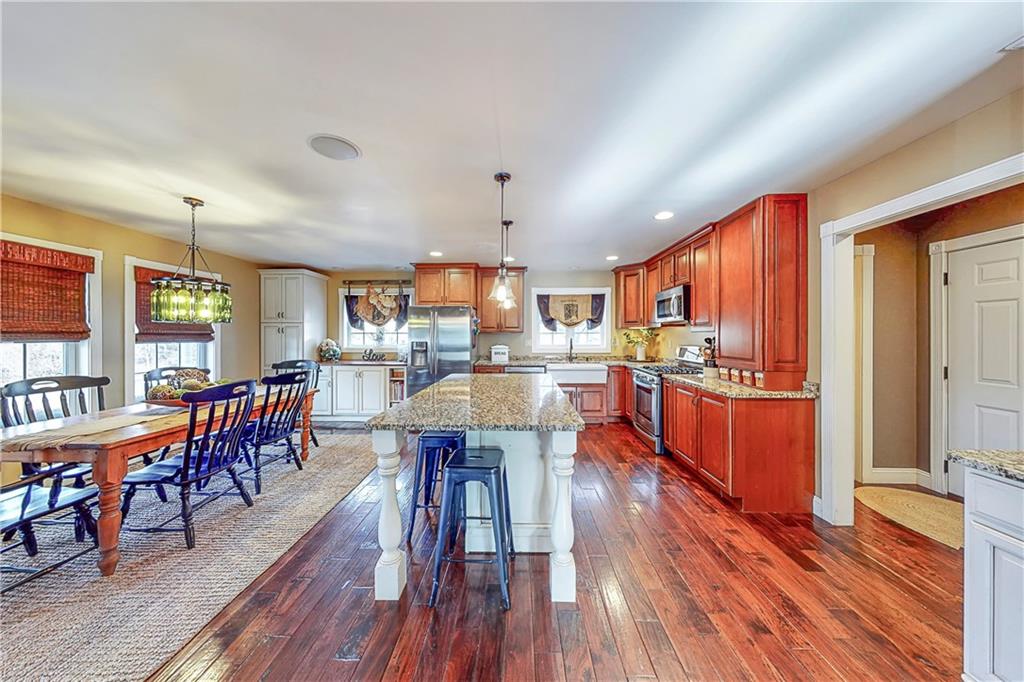 127 Miller Lane Road Waynesburg, PA 15370 - Photo 11 of 25 Kitchen boasts granite counters, ss appliances, huge island, custom cabinets & beverage station.