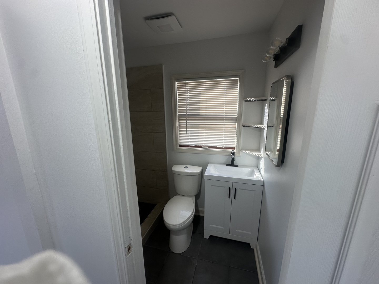410 Ivanhoe Road Grayslake, IL 60030 - Photo 7 of 9 a bathroom with a toilet sink and window