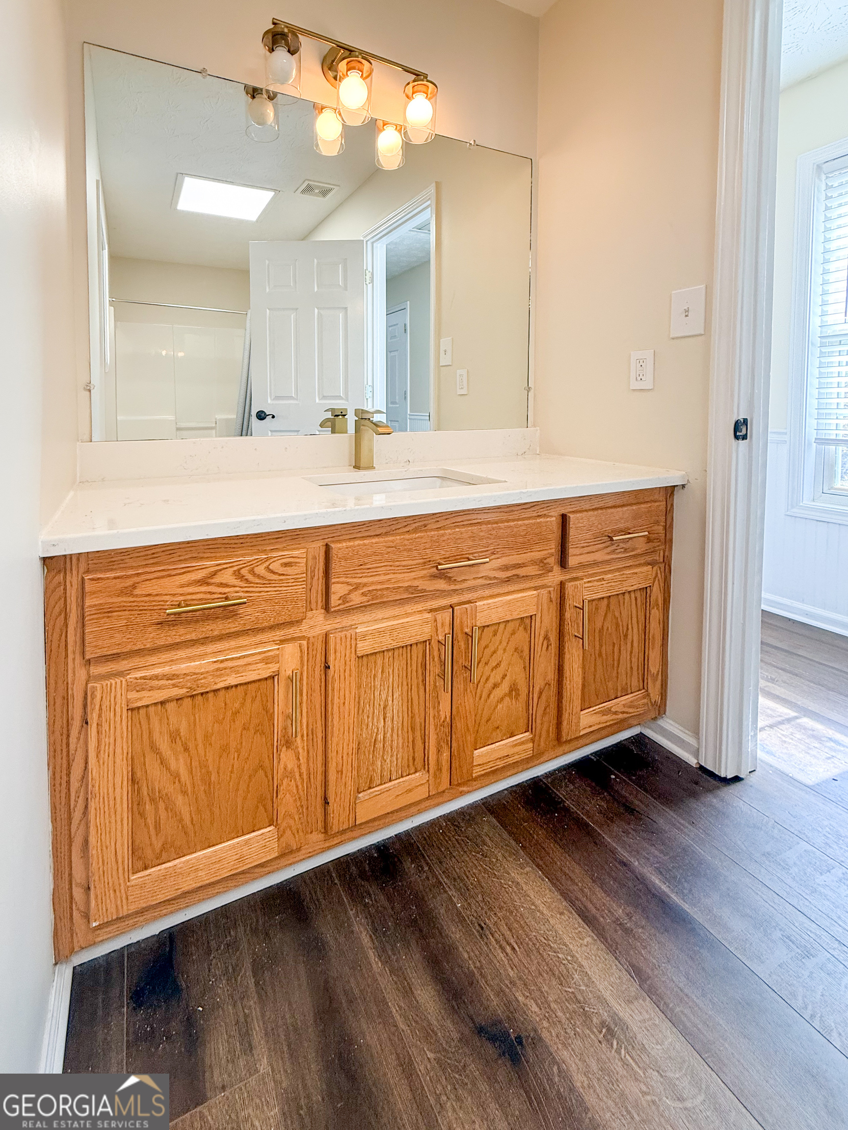499 Old Deer Path Way Cleveland, GA 30528 - Photo 16 of 26 a bathroom with a sink and a mirror