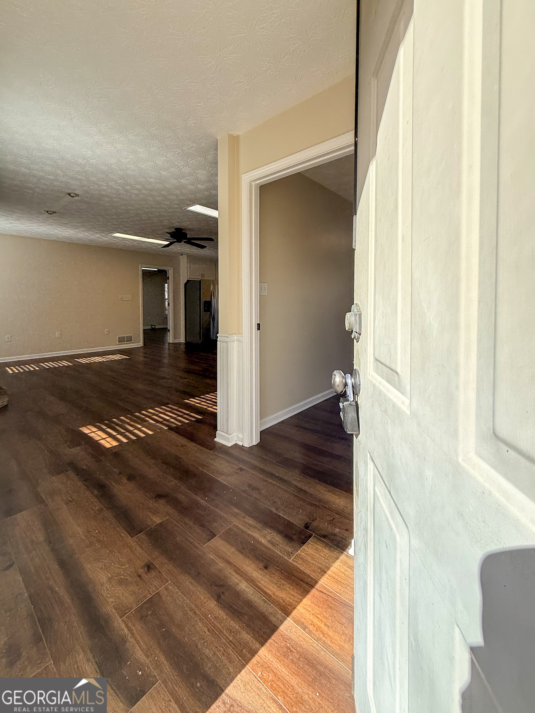 499 Old Deer Path Way Cleveland, GA 30528 - Photo 2 of 26 a view of a livingroom with wooden floor and stairs