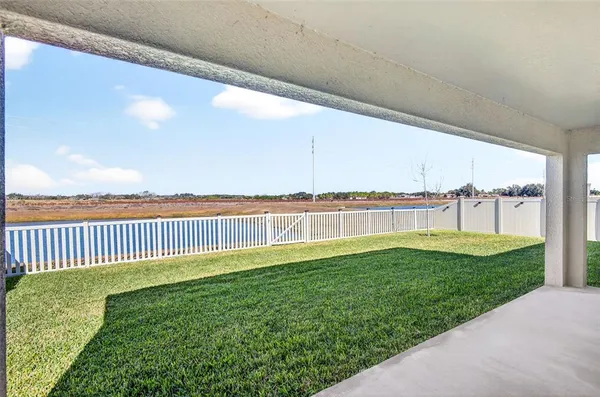 a view of a house with backyard
