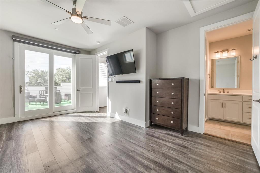 4785 Asher Place Dallas, TX 75204 - Photo 16 of 30 a view of an empty room with a window and wooden floor