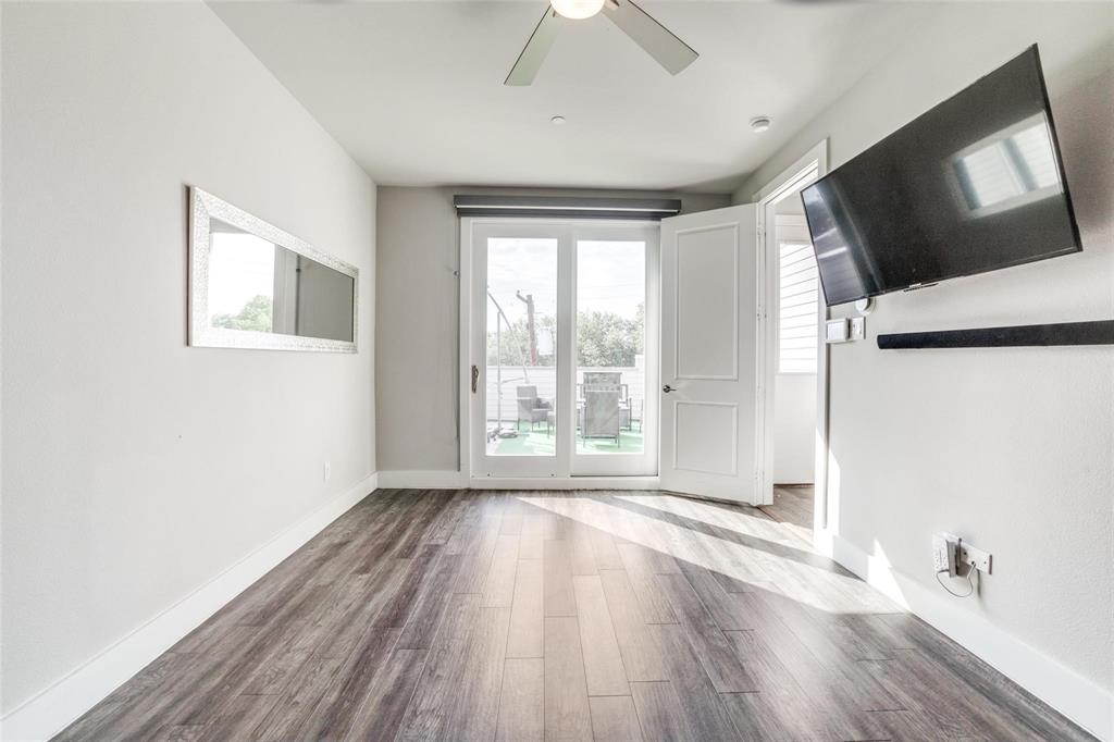 4785 Asher Place Dallas, TX 75204 - Photo 17 of 30 a view of livingroom with hardwood floor and window