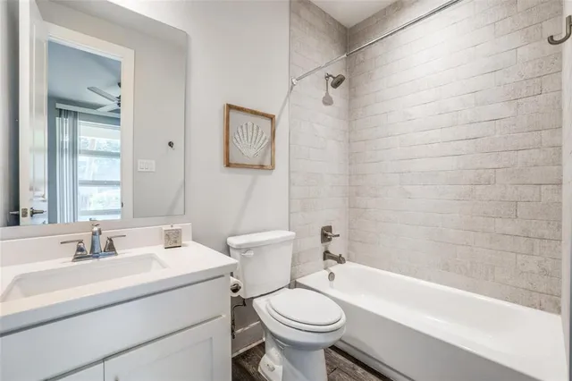 a bathroom with a sink toilet and bathtub