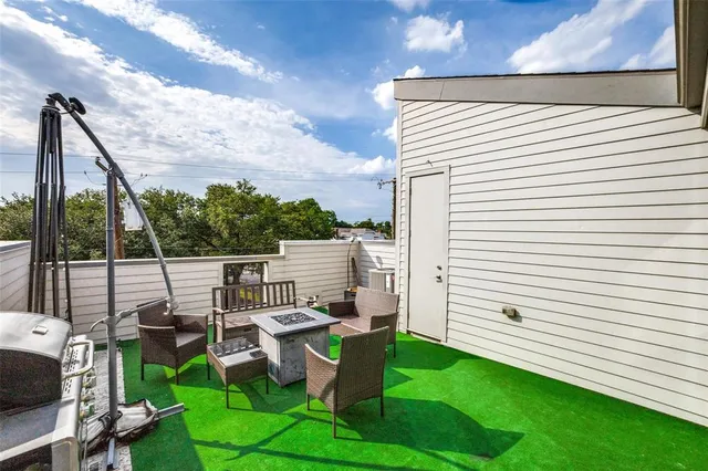 a couple of chairs sitting in backyard of house
