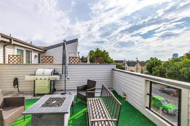 a view of a patio with table and chairs and potted plants