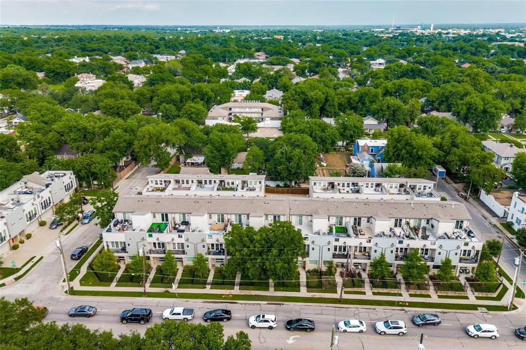 4785 Asher Place Dallas, TX 75204 - Photo 30 of 30 a aerial view of a large pool with lawn chairs and large trees