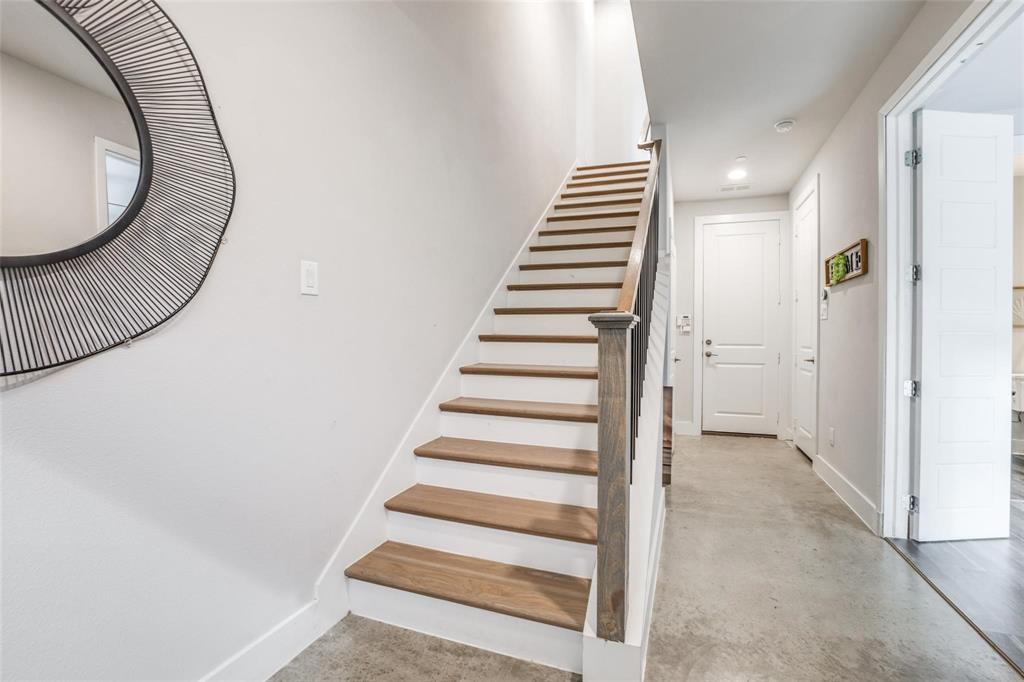 4785 Asher Place Dallas, TX 75204 - Photo 3 of 30 a view of a hallway with wooden floor and entryway