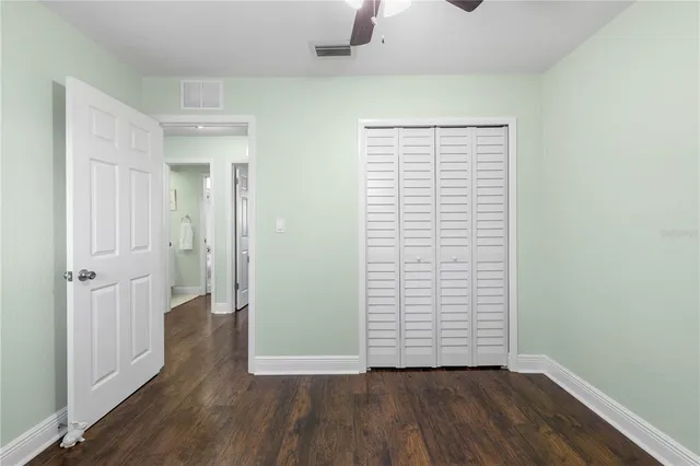 an aerial view of a house with a yard basket ball court and outdoor seating