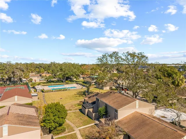 an aerial view of residential houses with outdoor space