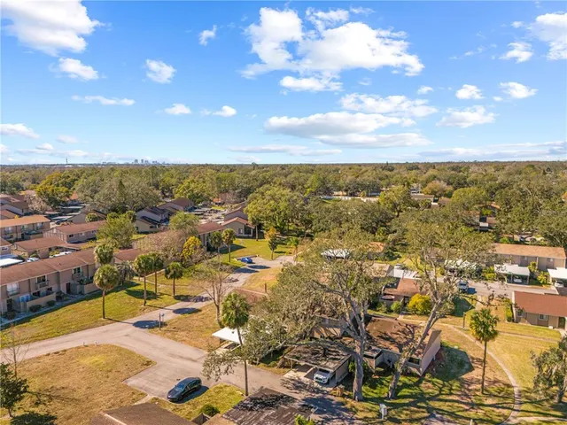 an aerial view of a house with a swimming pool