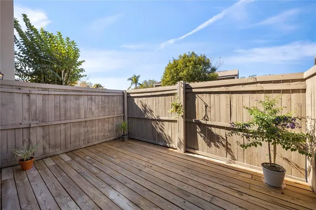 a living room with furniture and view of kitchen