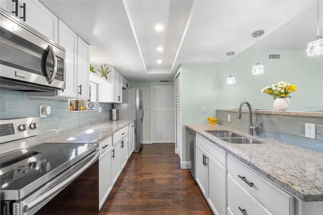 a view of living room with furniture and flat screen tv