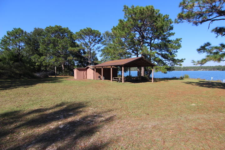 10 Spring Lake Road DeFuniak Springs, FL 32433 - Photo 7 of 14 a view of a house with a yard
