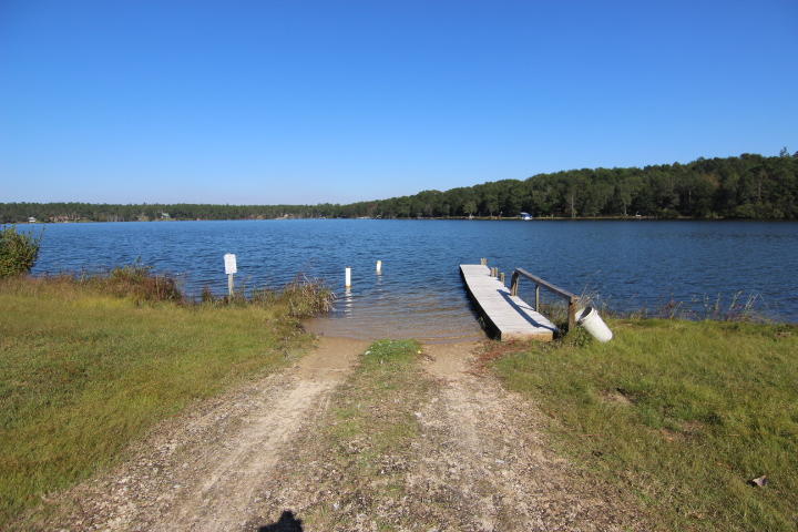 10 Spring Lake Road DeFuniak Springs, FL 32433 - Photo 9 of 14 a view of a lake with houses in the back