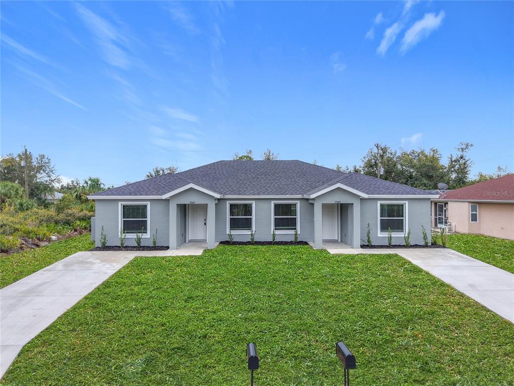 27169 Washington Street Punta Gorda, FL 33983 - Photo 1 of 1 a view of a house with a yard