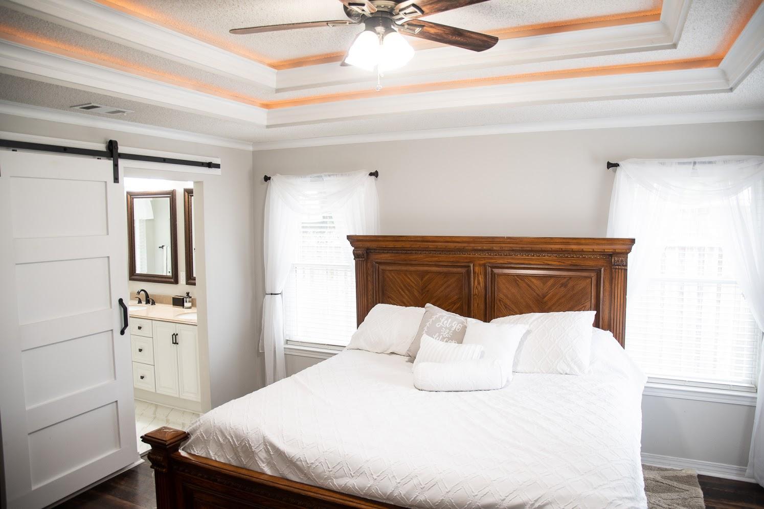 2802 Ping Lane Crestview, FL 32539 - Photo 13 of 30 a bedroom with a bed and a chandelier