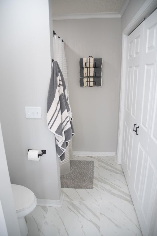 2802 Ping Lane Crestview, FL 32539 - Photo 17 of 30 a bathroom with a toilet and a shower