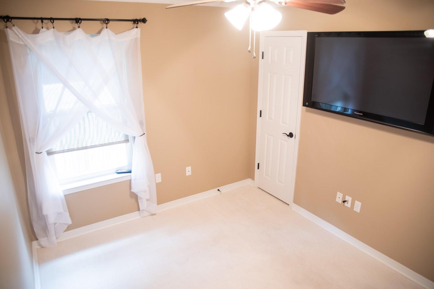 2802 Ping Lane Crestview, FL 32539 - Photo 21 of 30 a view of a small space with wooden floor and a window