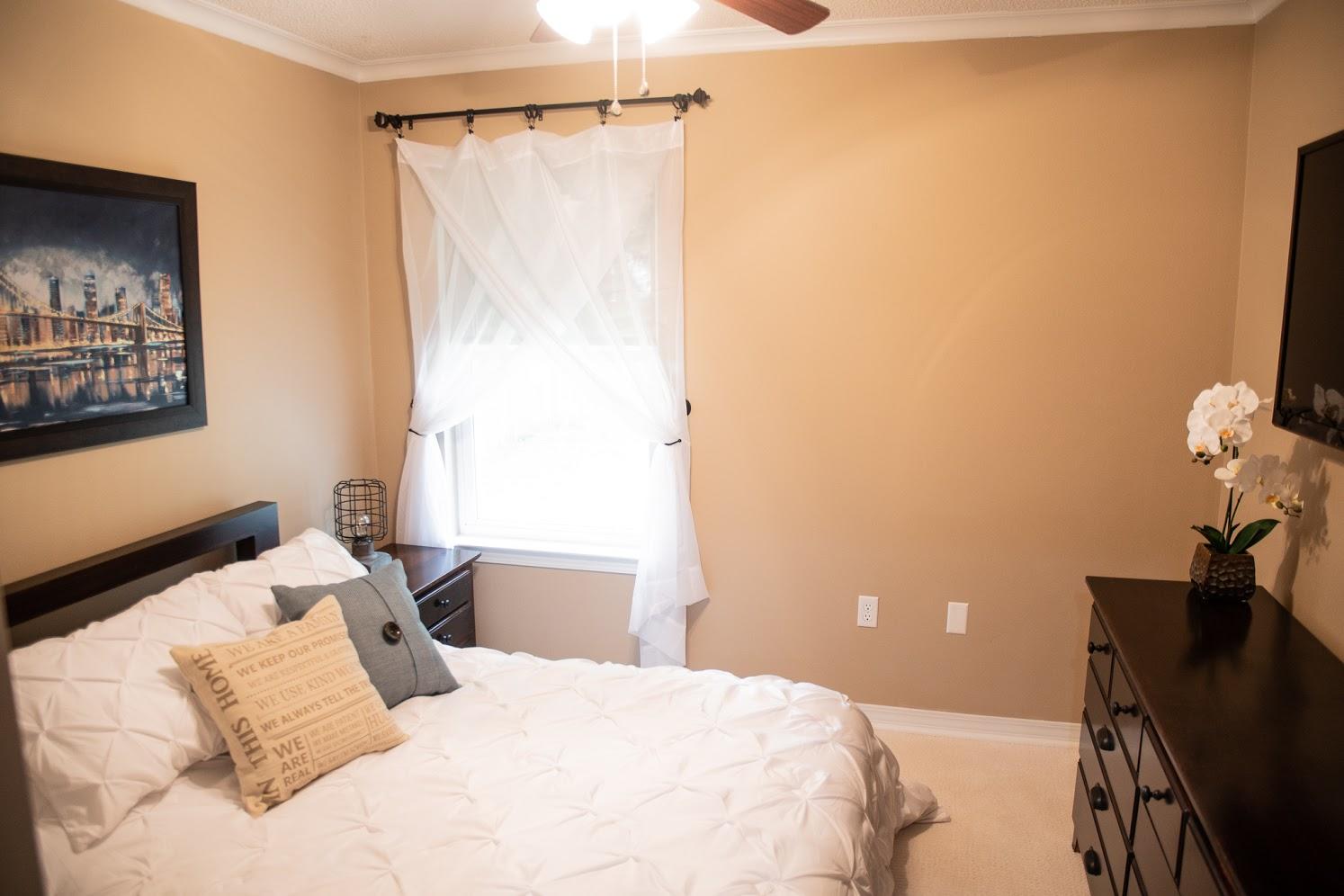 2802 Ping Lane Crestview, FL 32539 - Photo 23 of 30 a bedroom with a bed and a dresser