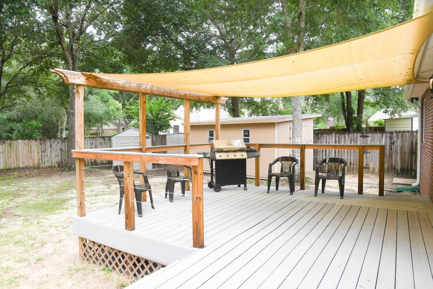 2802 Ping Lane Crestview, FL 32539 - Photo 27 of 30 a view of a patio with a table chairs and a patio