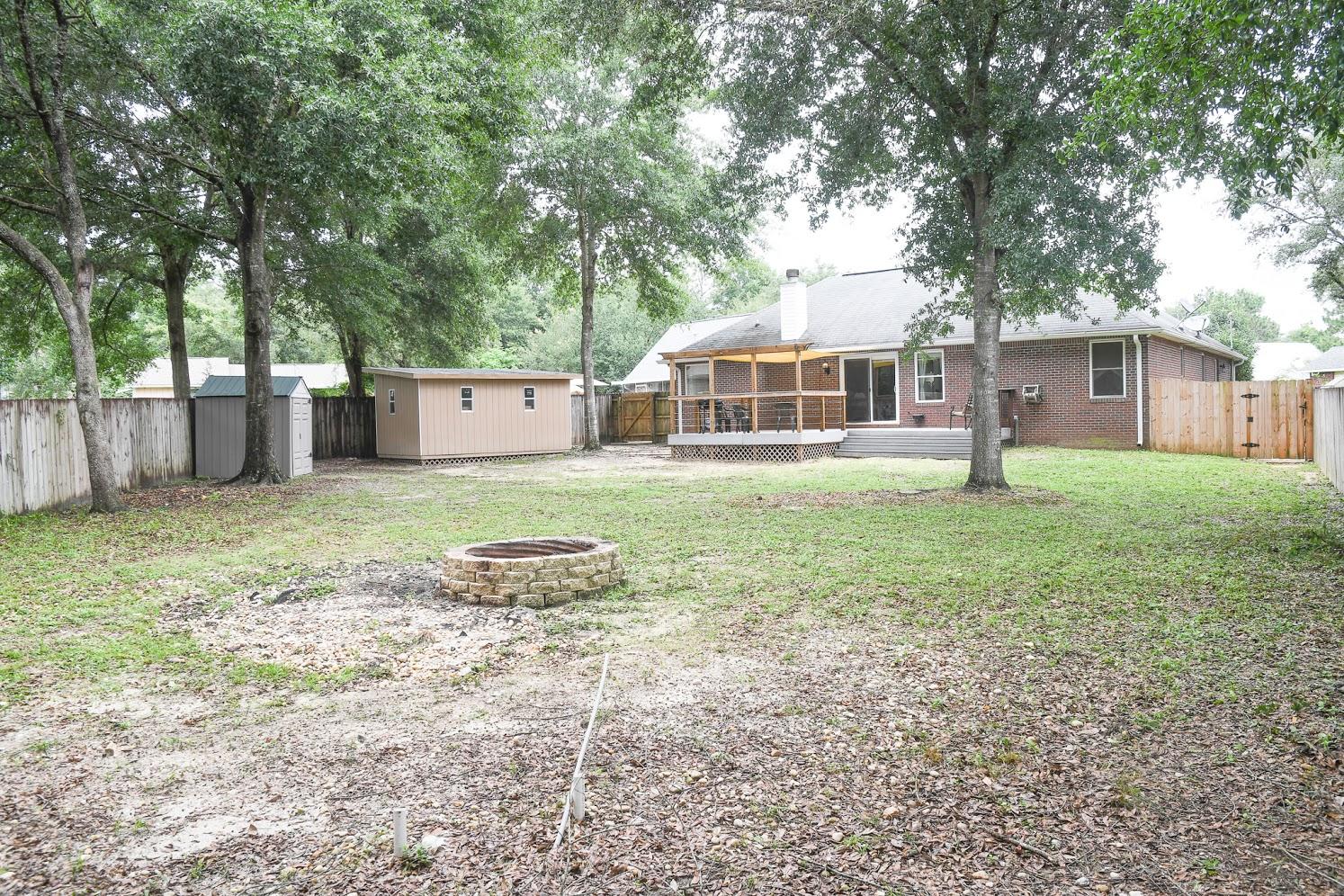 2802 Ping Lane Crestview, FL 32539 - Photo 28 of 30 a front view of a house with a yard and trees