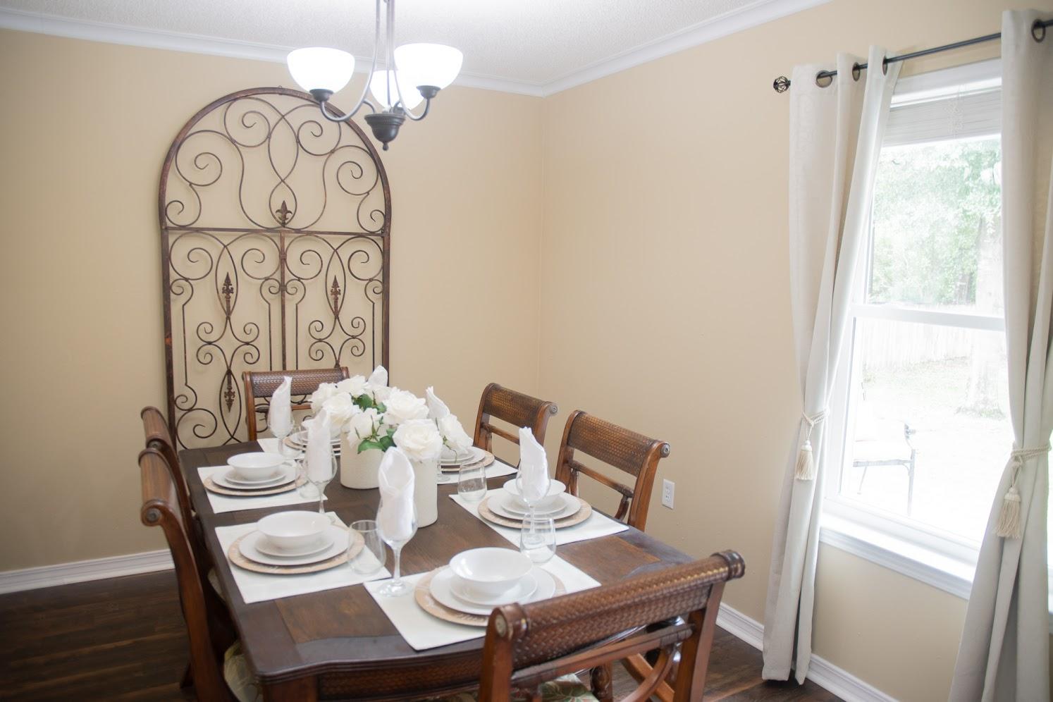 2802 Ping Lane Crestview, FL 32539 - Photo 7 of 30 a view of a dining room with furniture window and wooden floor