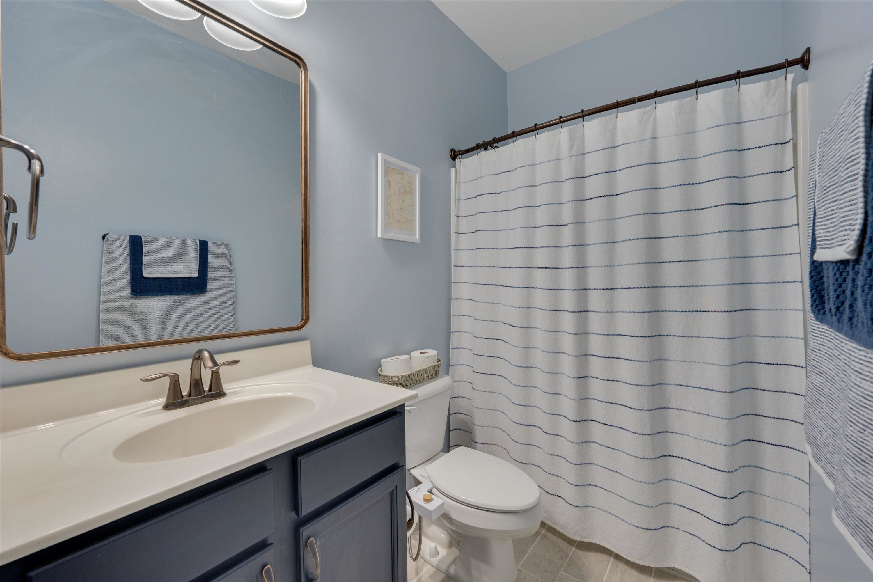 3717 Althorp Drive Raleigh, NC 27616 - Photo 11 of 23 a bathroom with a sink and a toilet