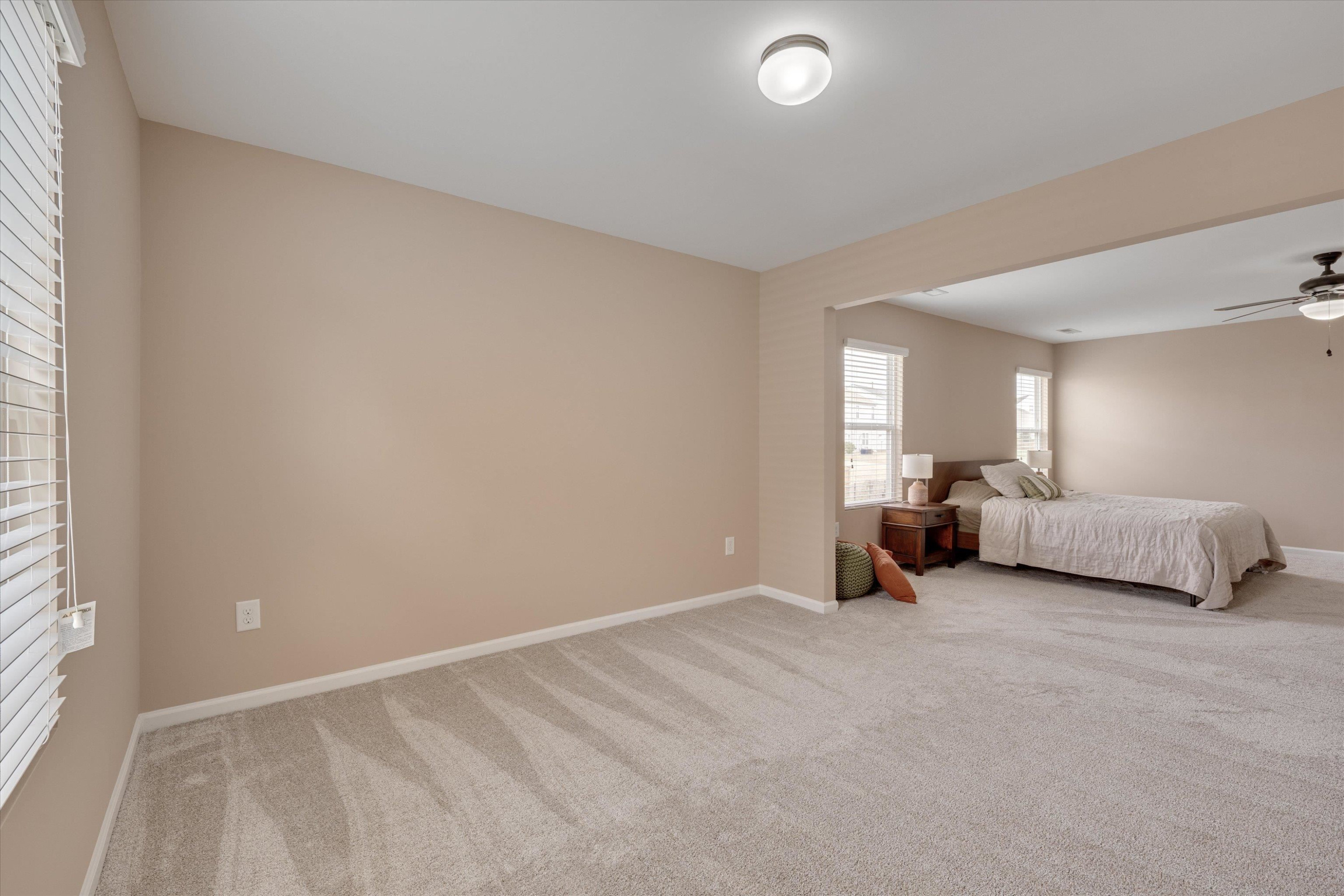 3717 Althorp Drive Raleigh, NC 27616 - Photo 16 of 23 a view of a bedroom with a bed and a couch