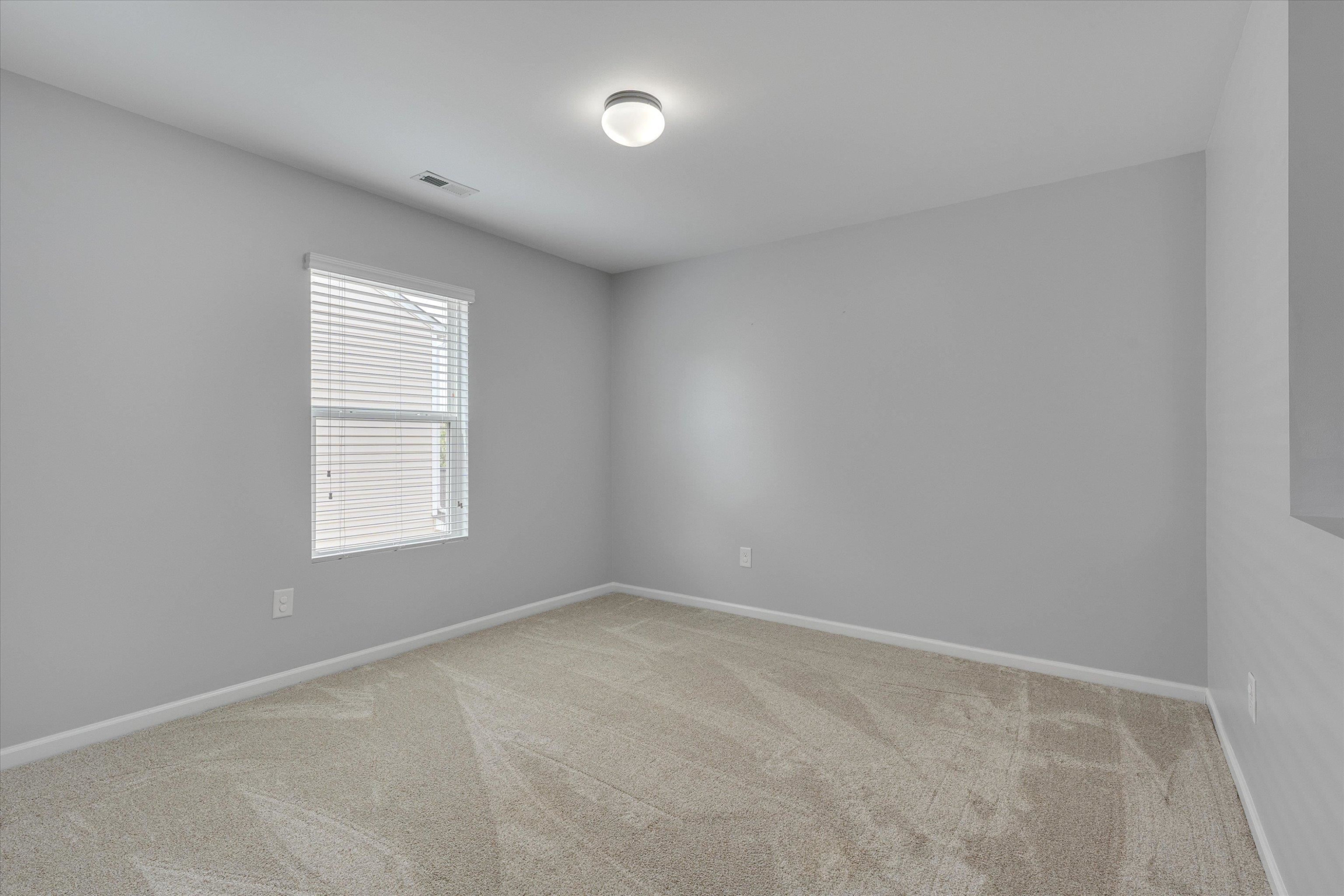 3717 Althorp Drive Raleigh, NC 27616 - Photo 21 of 23 an empty room with a window