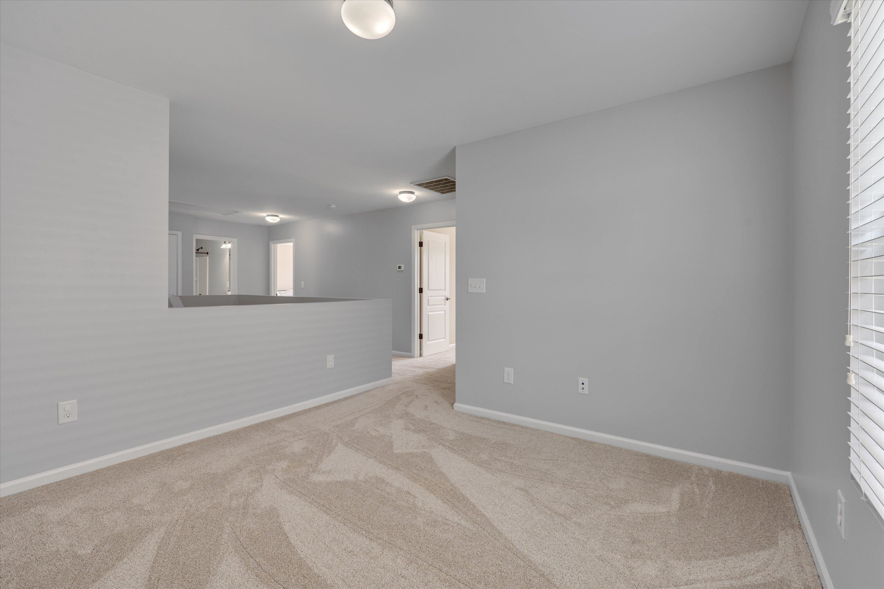 3717 Althorp Drive Raleigh, NC 27616 - Photo 22 of 23 an empty room with a bathroom