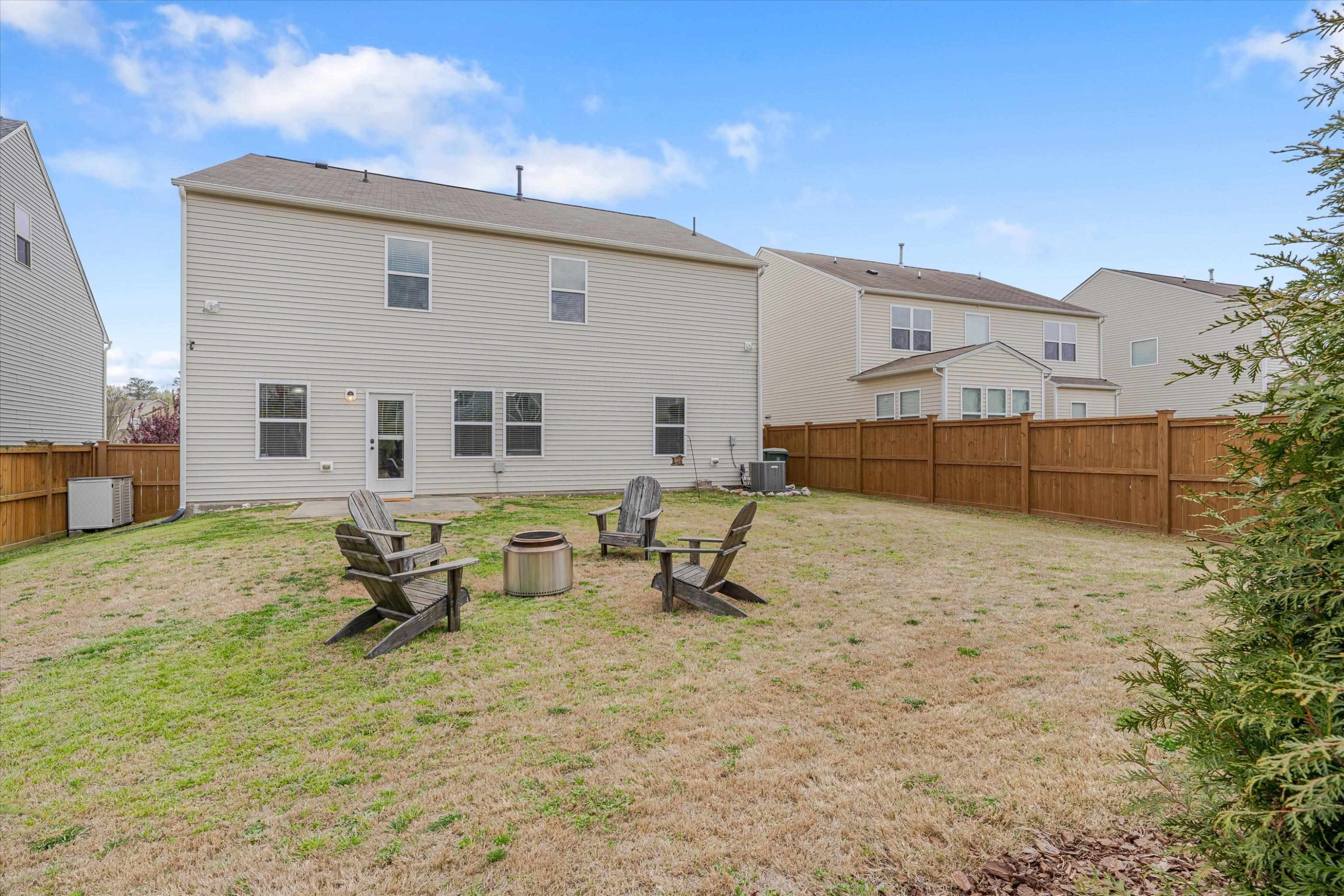 3717 Althorp Drive Raleigh, NC 27616 - Photo 23 of 23 a backyard of a house with outdoor seating