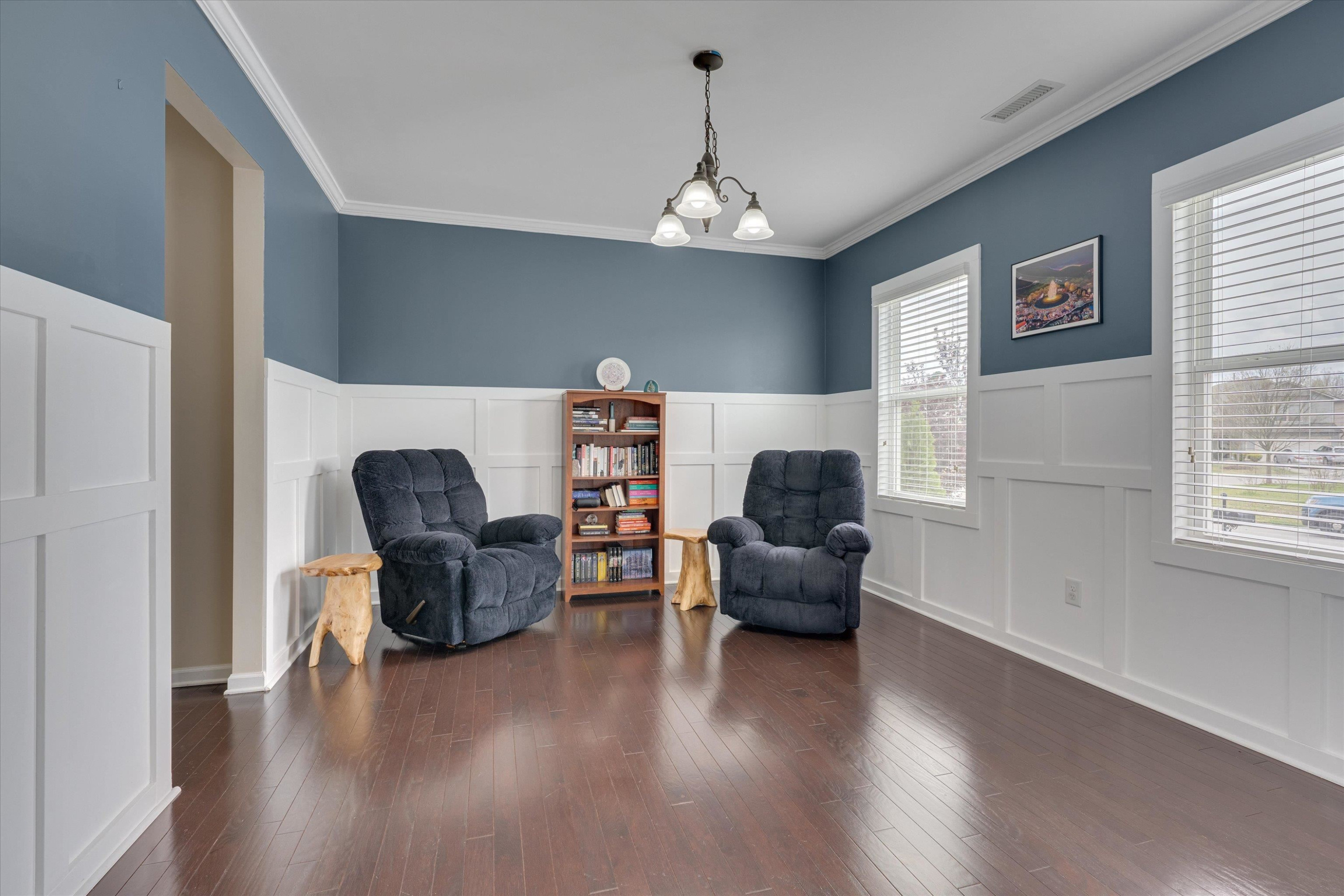 3717 Althorp Drive Raleigh, NC 27616 - Photo 3 of 23 a living room with furniture and a chandelier