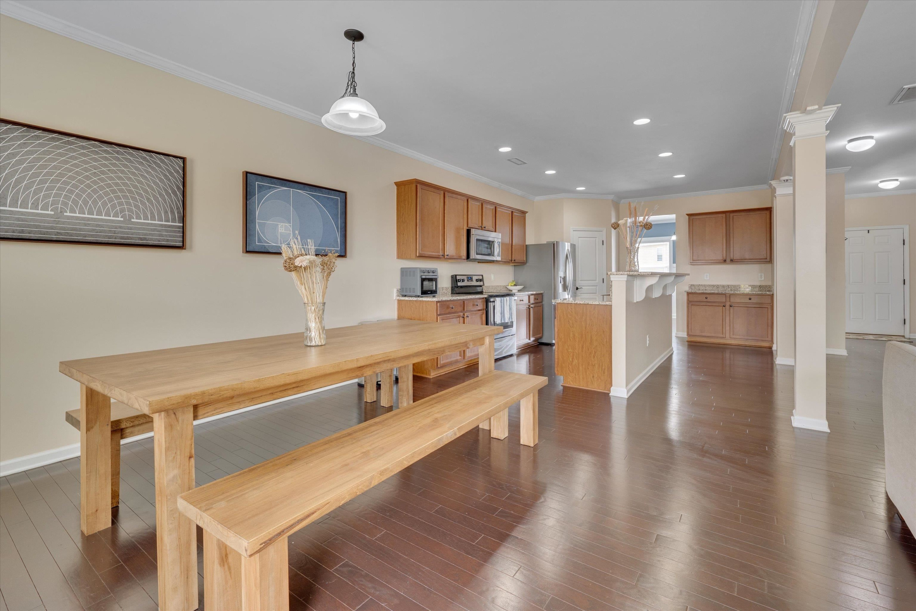 3717 Althorp Drive Raleigh, NC 27616 - Photo 7 of 23 a living room with stainless steel appliances furniture a flat screen tv and kitchen view