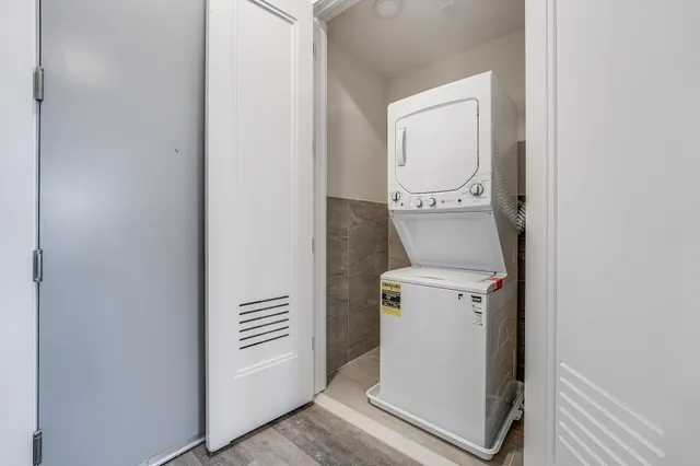 a utility room with closet dryer and washer