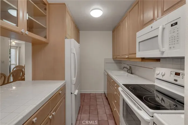 a view of kitchen with cabinets and outdoor space