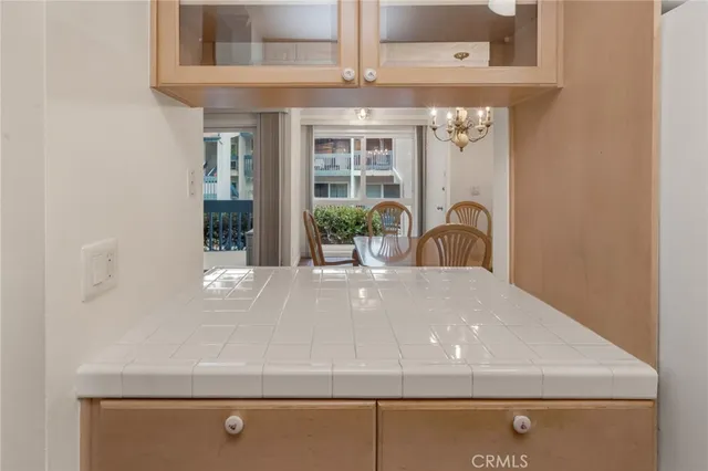 a stove top oven sitting inside of a kitchen