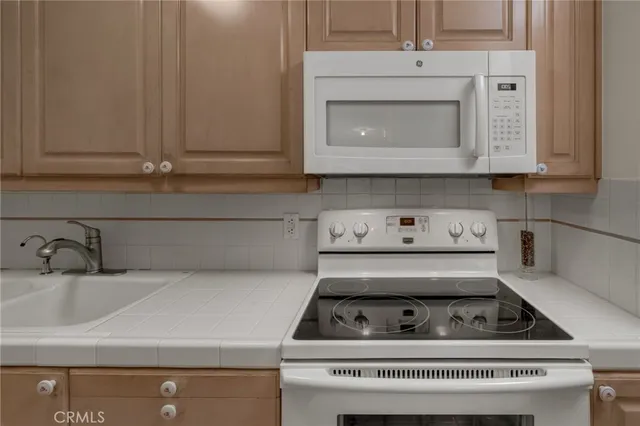 a view of a hallway with a livingroom and a hallway