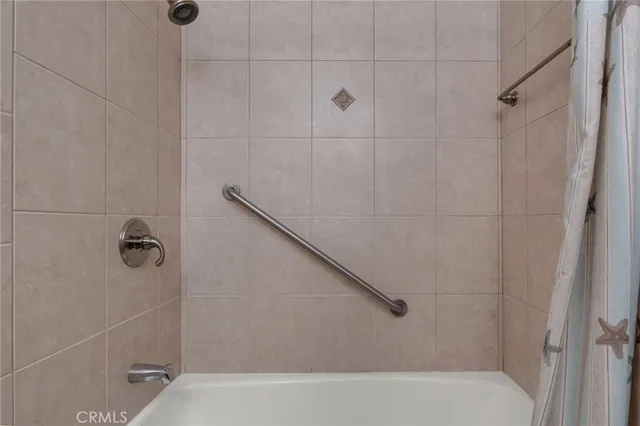 a living room with a couch and a flat screen tv