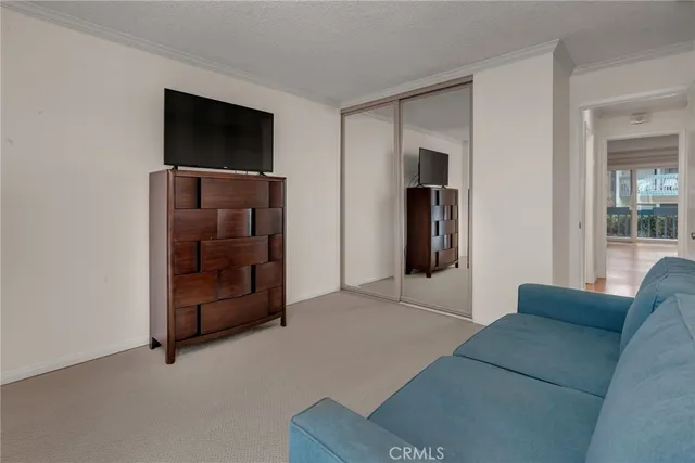 a living room with furniture and a bathroom