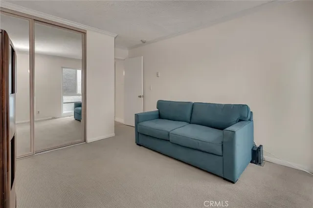 a bedroom with a bed lamp and a fireplace