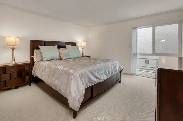 a bed room with a bed and a lamp