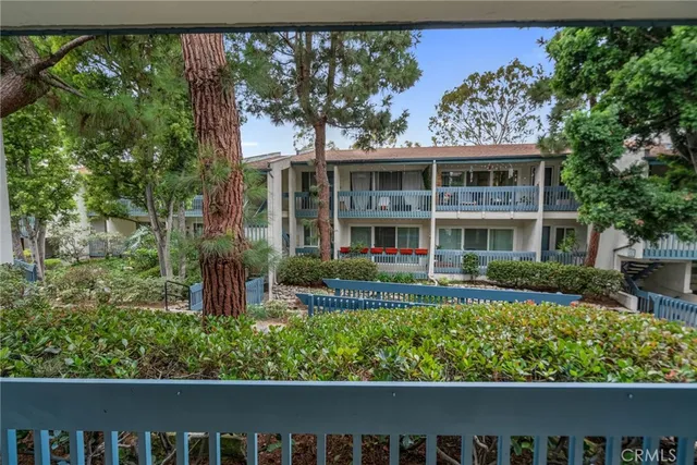 a view of balcony with wooden fence