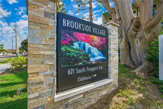 a view of a house with brick walls