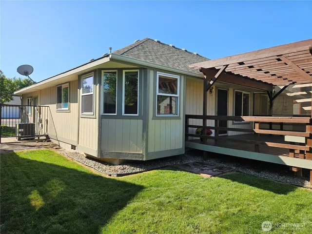 a view of a backyard with sitting area