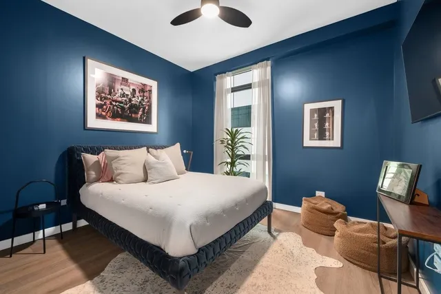 a bedroom with bed and a window